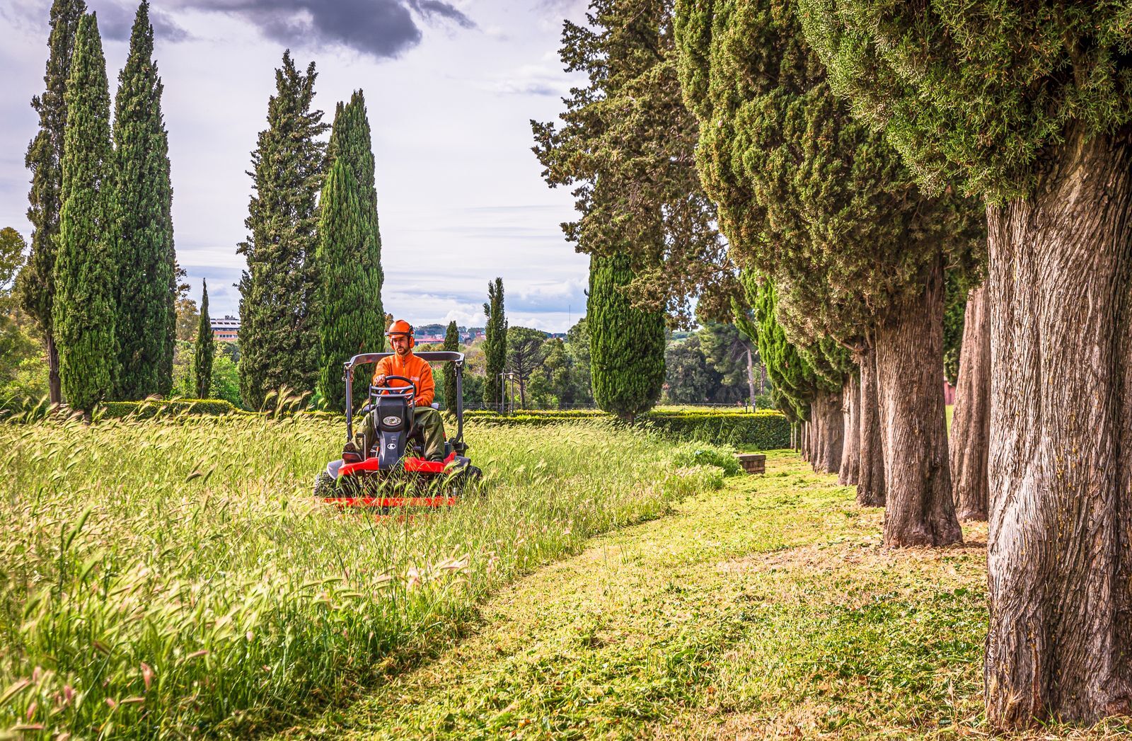 Ride-on mower cutting a large lawn