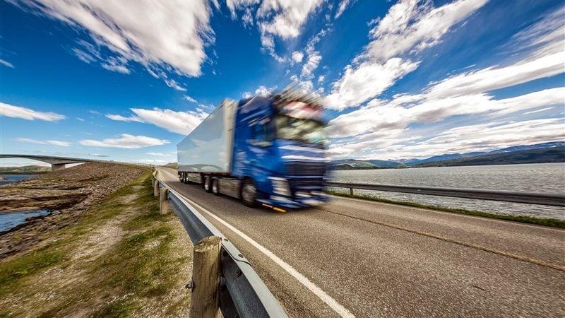 Prime mover and trailer on a highway